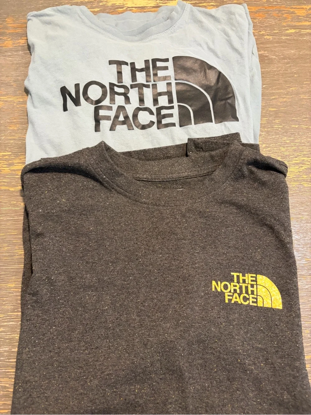 The North Face men’s  Short-Sleeve Tees in Gray and Black with Yellow Logo